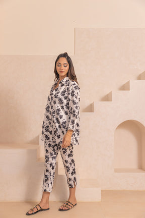 White floral satin co-ord set with stylish black patterns.