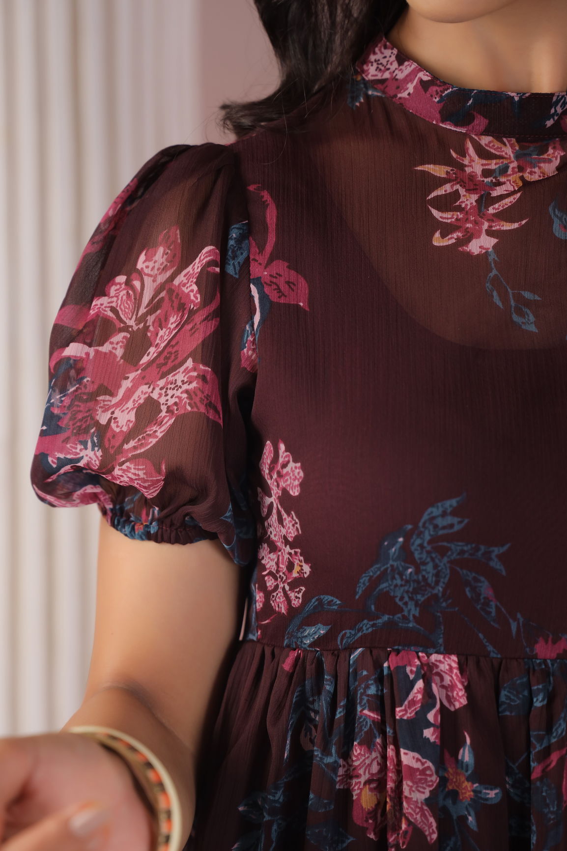 Wine floral maxi dress with puff sleeves and elegant design.