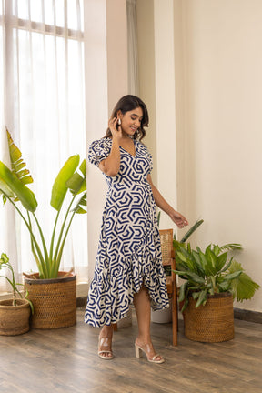Elegant wrap nursing maxi dress with geometric print and stylish ruffle hem.