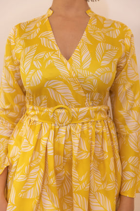 Yellow tropical satin co-ord with leaf patterns and stylish belt.