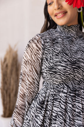 ZEBRA MAXI dress featuring stylish zebra print design and elegant silhouette.
