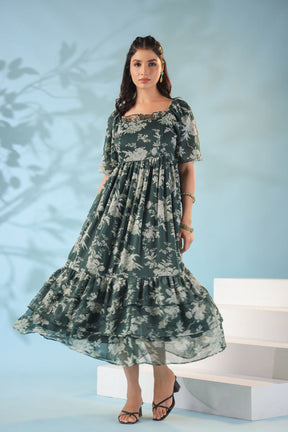 Green nursing maxi dress with floral design and layered ruffles.