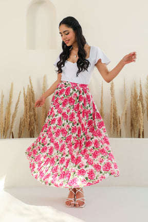 Floral pleated co-ord set with stylish white top and vibrant skirt.