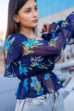 Berry blue floral top with vibrant embroidery and stylish puff sleeves.