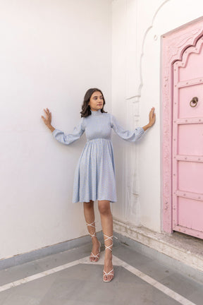 Cotton smocked midi dress in light blue with stylish sleeves.