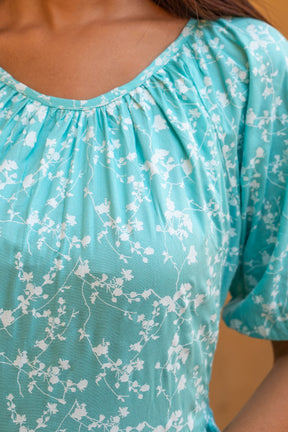 Sea blue floral maxi dress with elegant floral design.